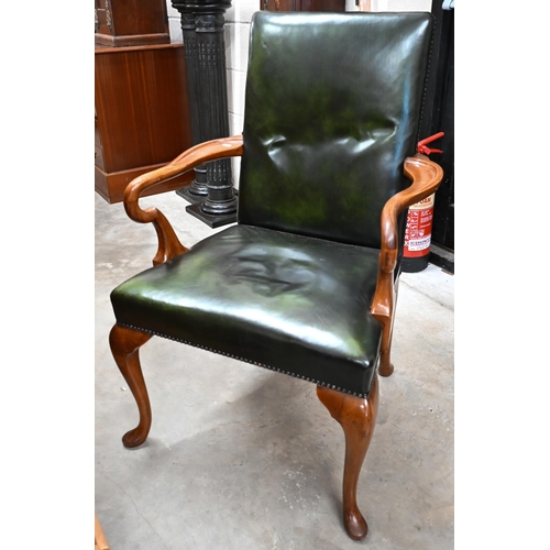 441 - A walnut framed Gainsborough style elbow chair with studded green leather upholstery