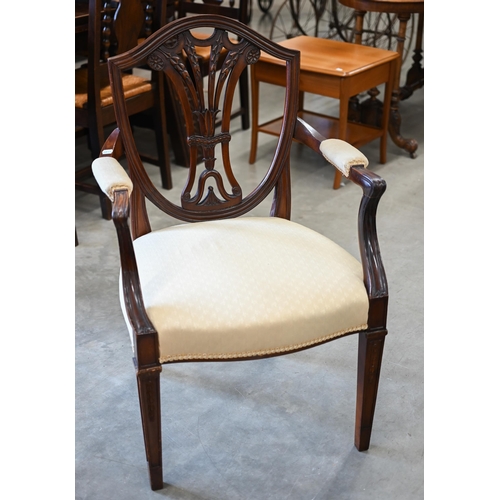 449 - A mahogany Hepplewhite style shield back elbow chair with foliate yellow upholstery