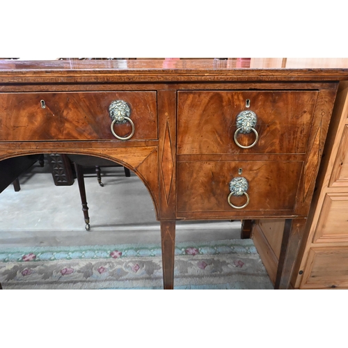 454 - A Regency mahogany sideboard with four drawers and brass lion mask ring handles raised on tapering s... 