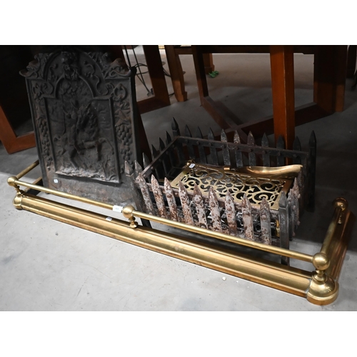 459 - A cast iron fire-back with relief equestrian group, 72 x 56 cm to/w an iron fire-basket, brass rail ... 