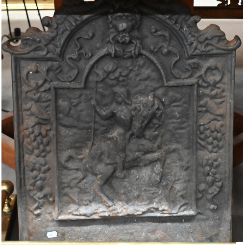 459 - A cast iron fire-back with relief equestrian group, 72 x 56 cm to/w an iron fire-basket, brass rail ... 