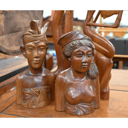 460 - Two Balinese carved teak busts and two figures (4)