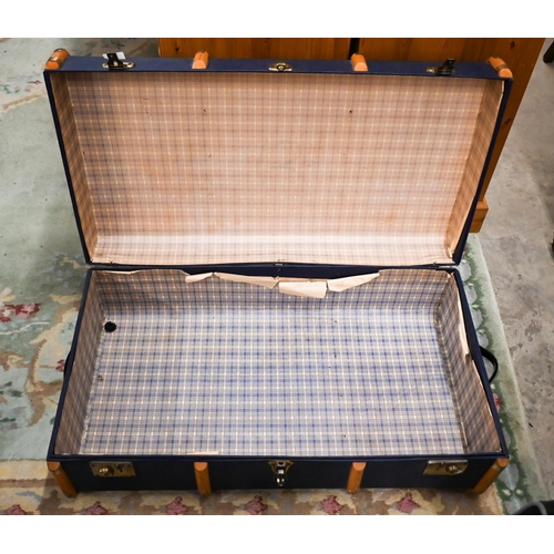 463 - A school pattern blue travelling trunk with wooden runners