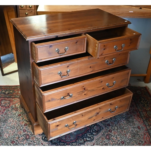 48 - A contemporary stained pine chest of two short over three long graduated drawers on shaped bracket f... 