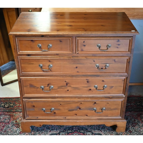 48 - A contemporary stained pine chest of two short over three long graduated drawers on shaped bracket f... 