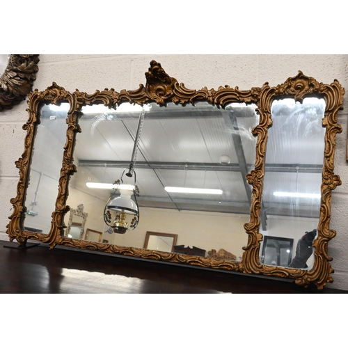 484 - A triple plate wall mirror with giltwood and gesso floral moulded frame, 112 cm wide x 64 cm high