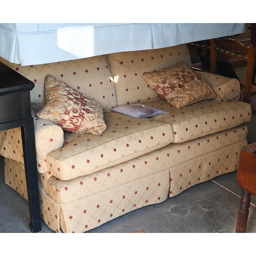 493 - A Multiyork two seater scroll arm sofa, with old gold diamond pattern loose covers c/w two scatter c... 