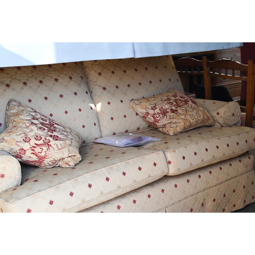 493 - A Multiyork two seater scroll arm sofa, with old gold diamond pattern loose covers c/w two scatter c... 