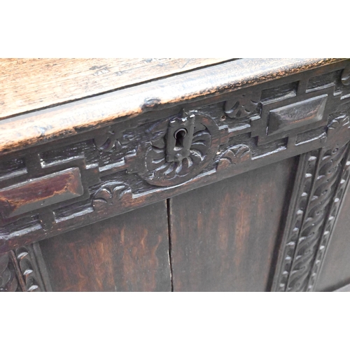 494 - Antique carved and panelled oak coffer with candle box fitted interior, 126 cm wide x 58 cm deep x 6... 