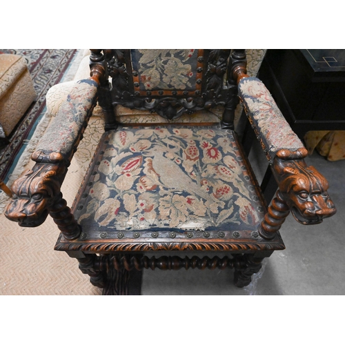 495 - Antique oak open armchair, the barleytwist frame supporting well carved oak leaf design back and lio... 