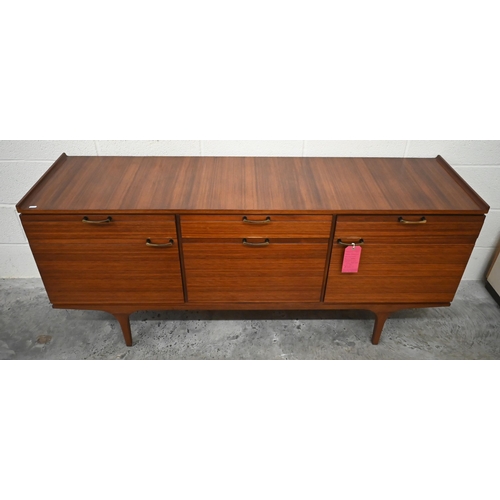 497 - A mid century Meredew rosewood sideboard circa 1960, the drawers and panelled cupboards fitted with ... 