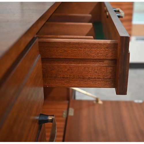 497 - A mid century Meredew rosewood sideboard circa 1960, the drawers and panelled cupboards fitted with ... 