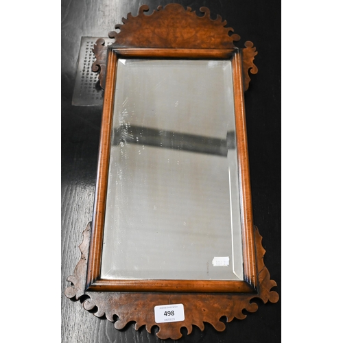 498 - Antique bevelled wall mirror in burr walnut fret cut frame, 58 cm high x 30 cm deep 