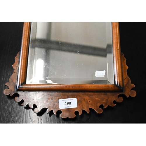 498 - Antique bevelled wall mirror in burr walnut fret cut frame, 58 cm high x 30 cm deep 