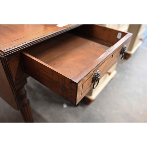 502 - A Regency mahogany crossbanded Pembroke table with box and ebony inlays, the end drawer with lion ma... 