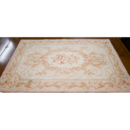 514 - A small Aubusson rug with traditional floral design, beige ground, 120 x 75 cm to/w small black cush... 