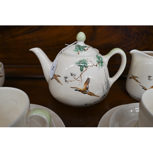 61 - Royal Doulton pottery tea service, printed with 'The Coppice' D5803 (22 pieces)