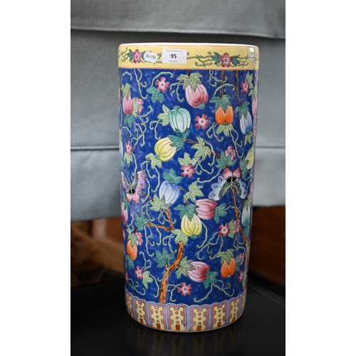 95 - Chinese porcelain cylindrical stick stand with polychrome enamel melons and moths on a blue ground, ... 