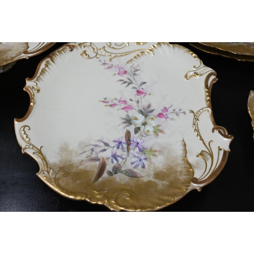 99 - Limoges floral-painted and gilded cabinet part service, including two comports and three plates (5)