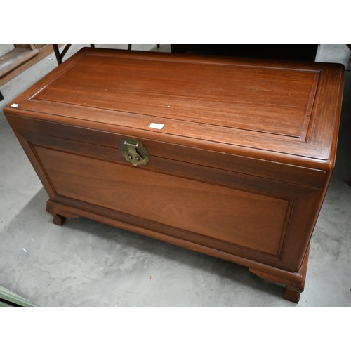 500 - A Chinese hardwood and brass mounted blanket chest of panelled construction with camphor lined inter... 