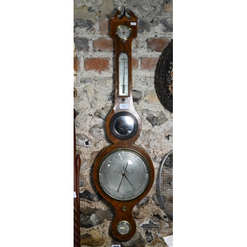 511 - A 19th century mahogany wheel barometer with silvered dial, thermometer, level centred by a convex p... 