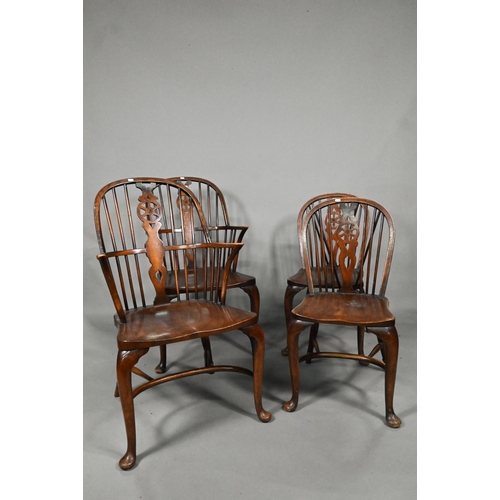 940 - A set of six oak and elm hoop and Windsor dining chairs, raised on crinoline stretchers, comprising ... 