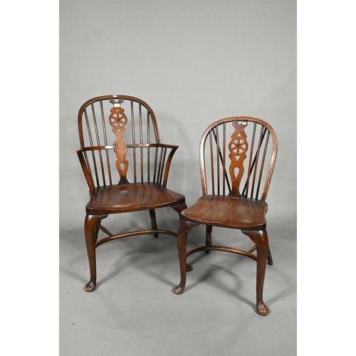 940 - A set of six oak and elm hoop and Windsor dining chairs, raised on crinoline stretchers, comprising ... 