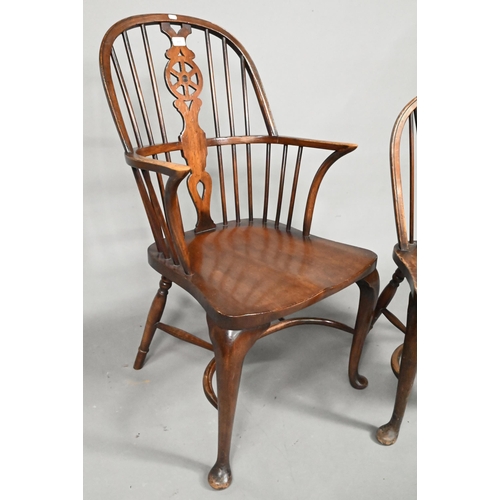 940 - A set of six oak and elm hoop and Windsor dining chairs, raised on crinoline stretchers, comprising ... 