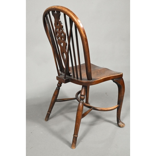 940 - A set of six oak and elm hoop and Windsor dining chairs, raised on crinoline stretchers, comprising ... 