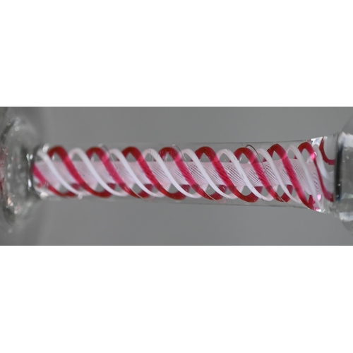 613 - A Georgian cordial glass cut with intertwined foliated guilloches, on red/white opaque triple-twist ... 