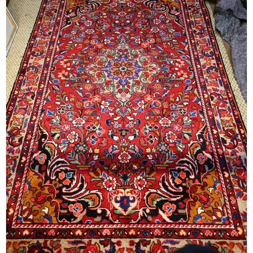 1051 - A Persian Lilihen carpet, 295 cm x 159 cm