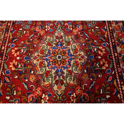 1051 - A Persian Lilihen carpet, 295 cm x 159 cm
