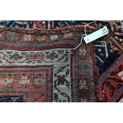 1057 - An antique Persian Kurd runner, the ink blue ground with repeating rows of stylised boteh, 417 cm  x... 