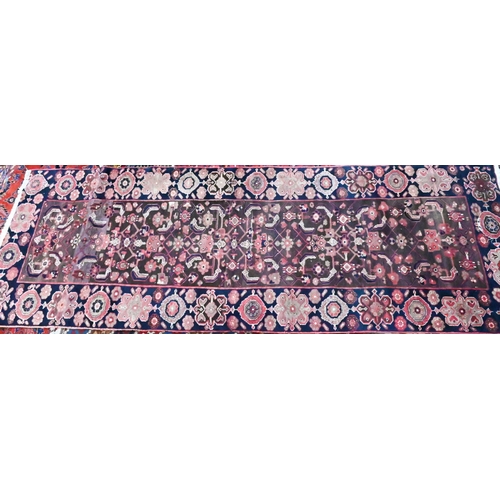 1060 - A Persian blue ground Lilihan runner, the repeating geometric design on brown ground, 296 cm x 104 c... 