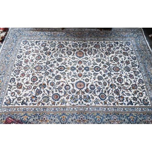 1065 - A mid-century Indo-Persian Kashan carpet, the camel ground with stylised floral vine design, 2nd hal... 