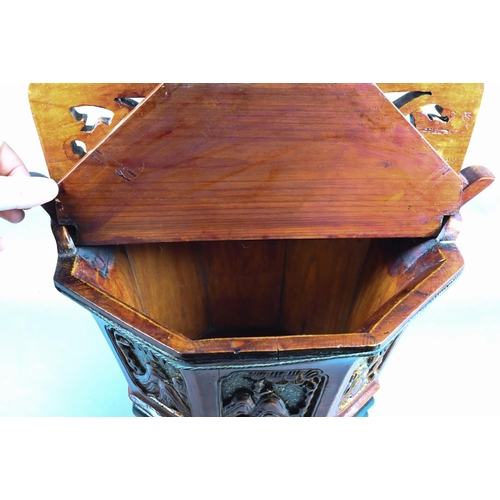 582 - A Chinese stained hardwood water bucket of tapering octagonal form with floral and foliate fret-cut ... 