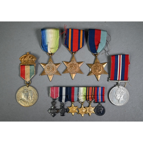 1160 - A Royal Navy miniature GRVI Distinguished Service Cross medal group comprising an MBE, DSC, 1939-45 ... 