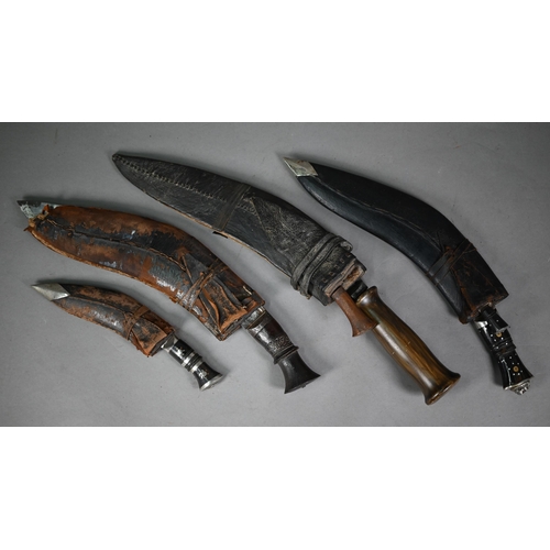 1313 - Four various Nepalese kukris of varying sizes, 50 cm - 26 cm