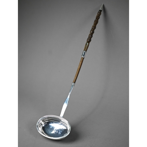 104 - Georgian silver punch ladle with oval bowl and stem, the twisted whalebone handle with silver band, ... 