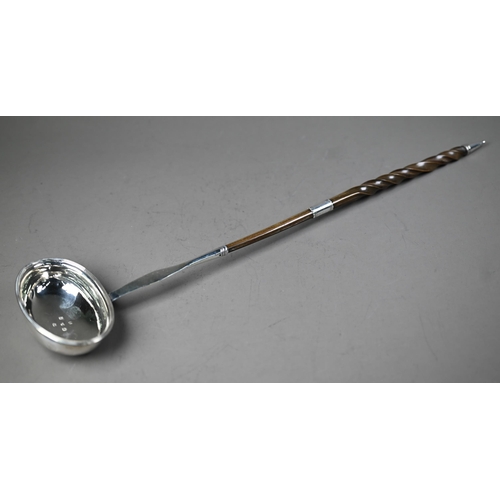 104 - Georgian silver punch ladle with oval bowl and stem, the twisted whalebone handle with silver band, ... 