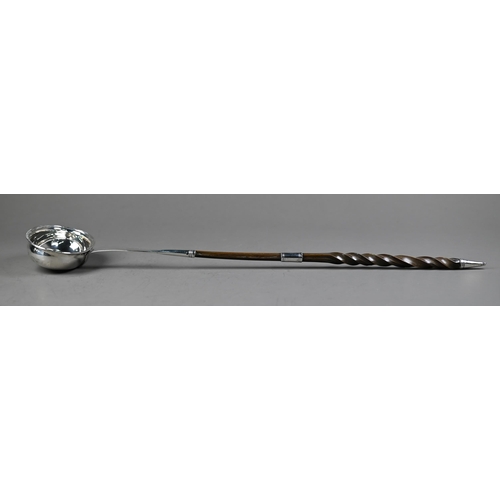 104 - Georgian silver punch ladle with oval bowl and stem, the twisted whalebone handle with silver band, ... 