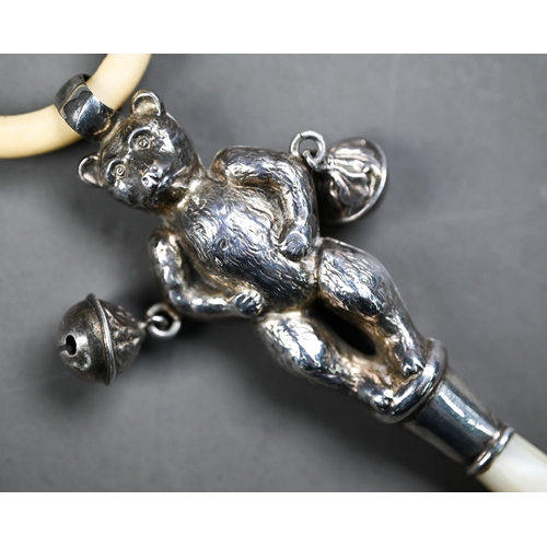 107 - Silver 'teddy bear' baby's rattle with composite teething ring, two bells and mother of pearl handle... 