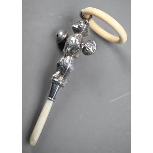 107 - Silver 'teddy bear' baby's rattle with composite teething ring, two bells and mother of pearl handle... 