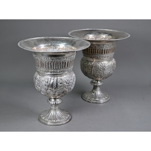 118 - A pair of Continental electroplated champagne ice-buckets in the form of campana urns on stemmed bas... 