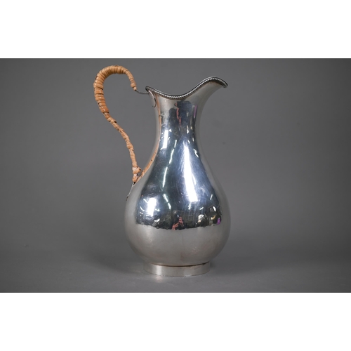 127 - Hester Bateman: a George III silver pear-shaped water-jug with beaded rim and wicker-bound handle, o... 