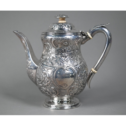 143 - A George III silver coffee pot with embossed decoration and ivory insulators and finial pillar, Edwa... 