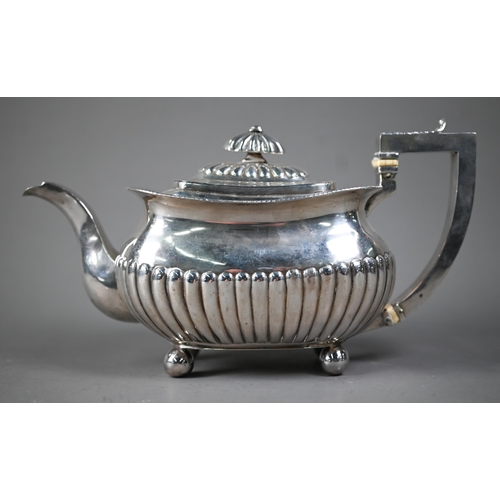 144 - A George III silver half reeded oblong teapot with ivory insulators, on bun feet, Solomon Hougham (p... 