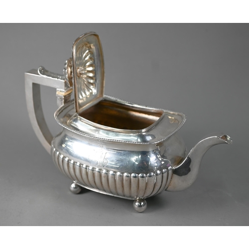 144 - A George III silver half reeded oblong teapot with ivory insulators, on bun feet, Solomon Hougham (p... 