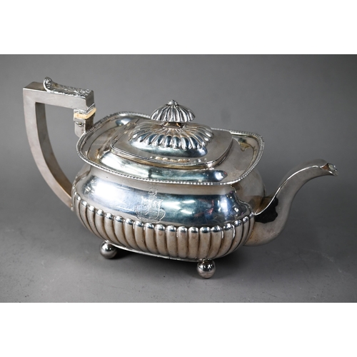 144 - A George III silver half reeded oblong teapot with ivory insulators, on bun feet, Solomon Hougham (p... 