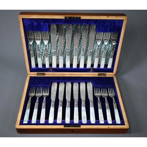 15 - Mahogany cased set of twelve each electroplated fish knives and forks with mother of pearl handles, ... 